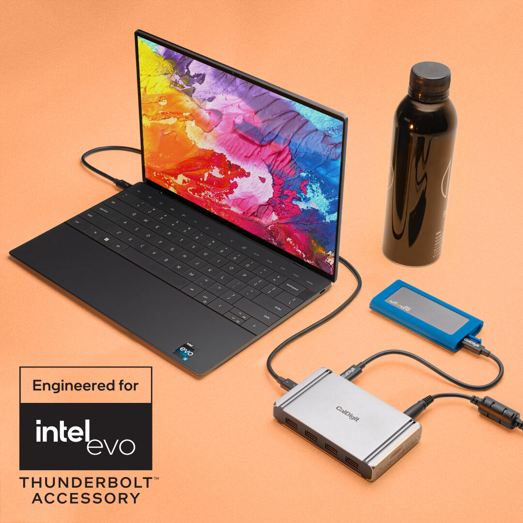 Desk setup of an Intel Evo supported laptop plugged into the CalDigit Element 5 and a Tuff Nano Plus.
